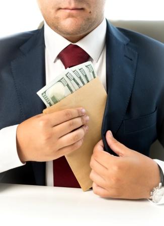 063485496-businessman-hiding-envelope-mo.jpeg