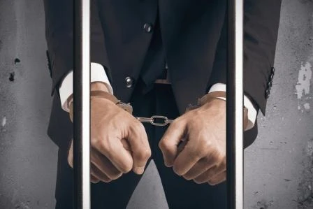 handcuff-businessman-compressed.jpeg