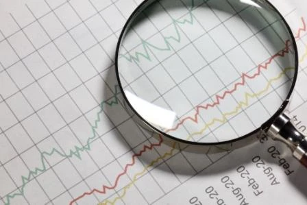 075977853-business-chart-and-magnifying-.jpeg