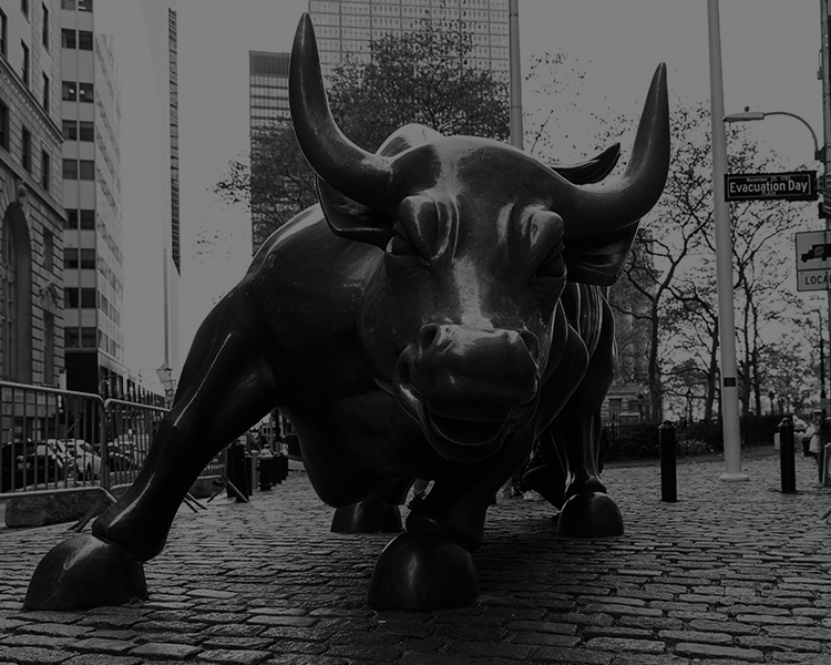 A monochrome image of a bull statue