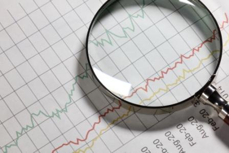 075977853-business-chart-and-magnifying-.jpeg